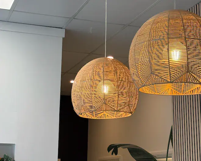 Woven pendant lights above the salon floor
